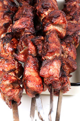 barbecue skewers on a white wooden background top view top view shallow depth of field