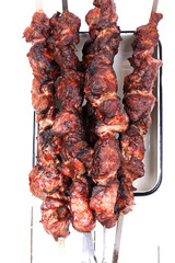 barbecue skewers on a white wooden background top view top view shallow depth of field