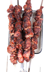 barbecue skewers on a white wooden background top view top view shallow depth of field