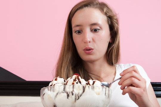 Young Woman Excited About Giant Ice Cream Sundae