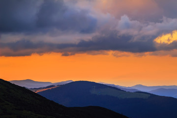 Picturesque and dramatic Carpathian mountains landscape, sunset evening time, Ukraine.