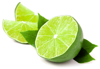 lime with slices and leaf isolated on white background
