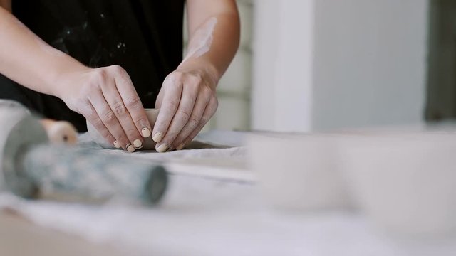 Female potter creating a bowl. 
