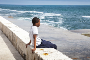 Portrait of a african boy on the seashore