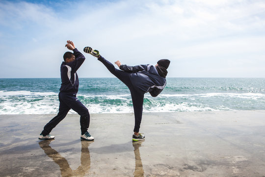 Children training karate on the stone coast