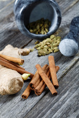 Still-life of spice and mortar on a wooden table