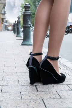 Female feet on a city street