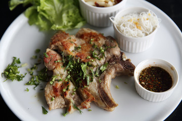 Grilled Porkchop on wood background