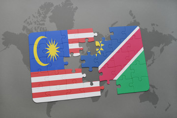 puzzle with the national flag of malaysia and namibia on a world map background.