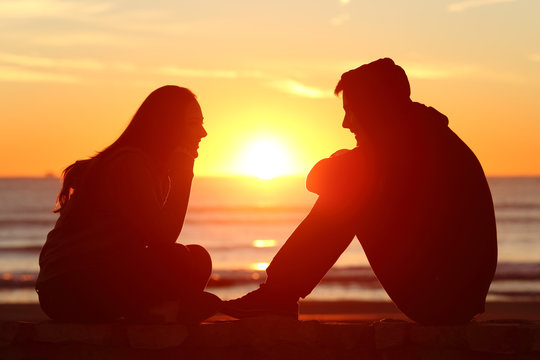 Friends Or Couple Of Teens Facing At Sunset