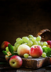 Grapes and nectarines, vintage wooden background, selective focu