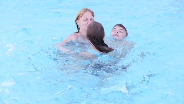 Happy family enjoying in pool