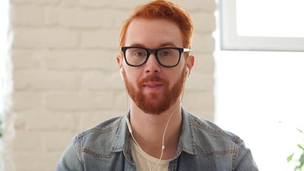 Taking Online, Video Chat, Skype by Man with Beard and Red Hairs - Powered by Adobe