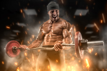 Fototapeta na wymiar Angry athlete trains in the gym