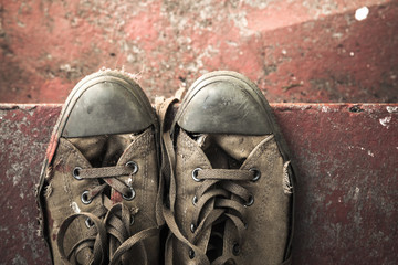 Sneakers on concrete stairs, top view