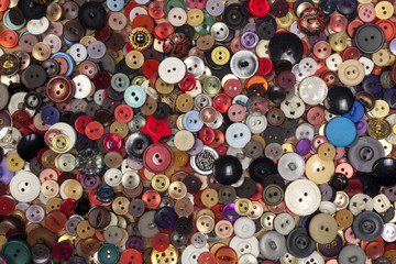 Colorful background covered in hundreads of buttons