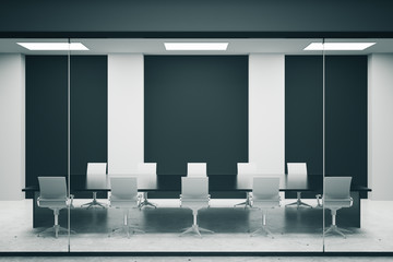 Conference room with black posters