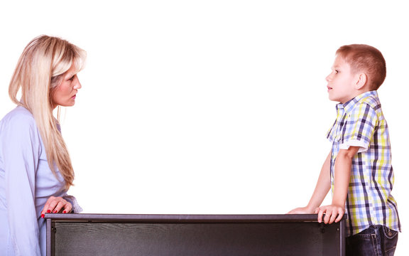 Mother And Son Talk And Argue Sit At Table.