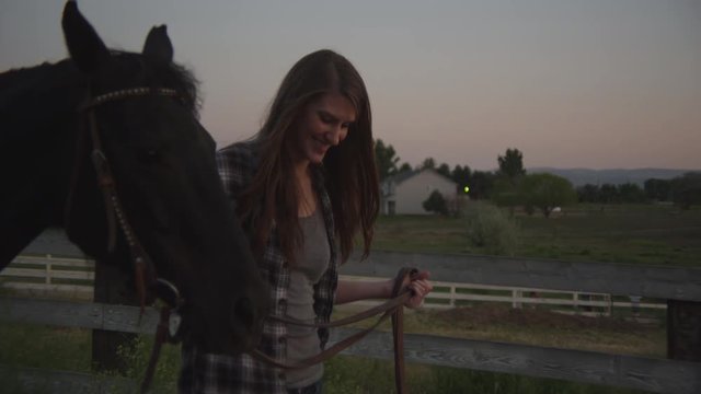 Slow motion woman leading a horse