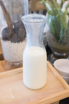 Glass jug of fresh milk
