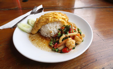 Spicy seafood with basil leaves serving with rice