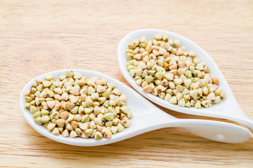Buckwheat groats in spoon.