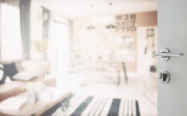 opened white door to modern living corner next to the dining room