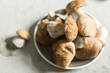 plate with fresh white mushrooms