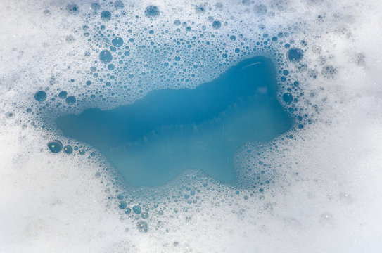 white foam on blue water