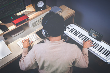 music composer making songs in recording studio