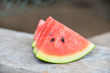 Fresh water melon on wood texture.