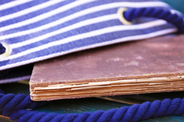 Handbag with book on wooden bench