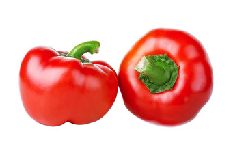 Two red peppers on a white background