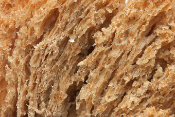 Texture from dark bread as a background for your project, macro
