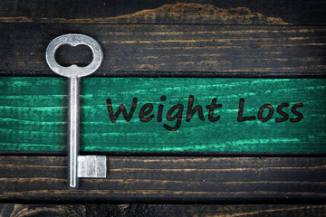 Obraz premium Weight Loss word and old key