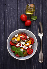 Colorful tomatoes salad with feta cheese