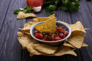 Mexican corn chips nachos with salsa dip