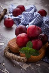 Sweet plums on wooden background
