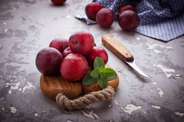 Sweet plums on wooden background