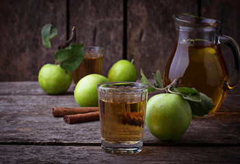 Glasses with apple juice on wooden table