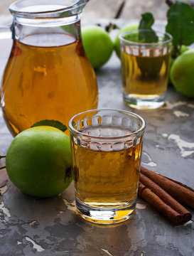 Glasses with apple juice on wooden table