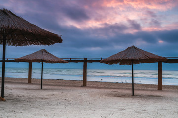 beach umbrellas at sunrise