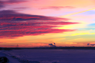red sunset over the winter river