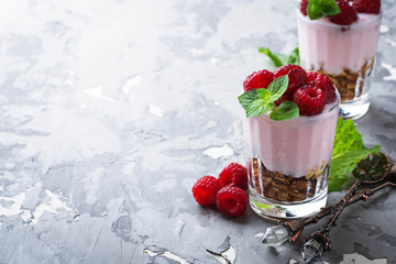 Dessert with granola, yogurt and raspberry