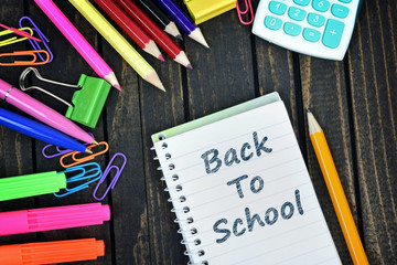 Back to school text on notepad and office tools