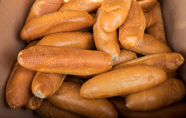Fresh bread rolls in a box at the city market