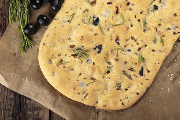 Italian focaccia bread with olives and rosemary.
