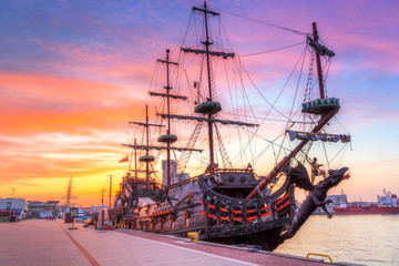 Obraz premium Pirate ship in Gdynia harbour at sunset, Poland
