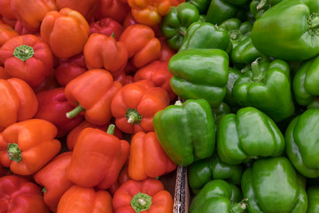 Green and red bell pepperss for sale at the city farmers market