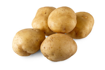 Stack of raw potatoes closeup isolated on white background